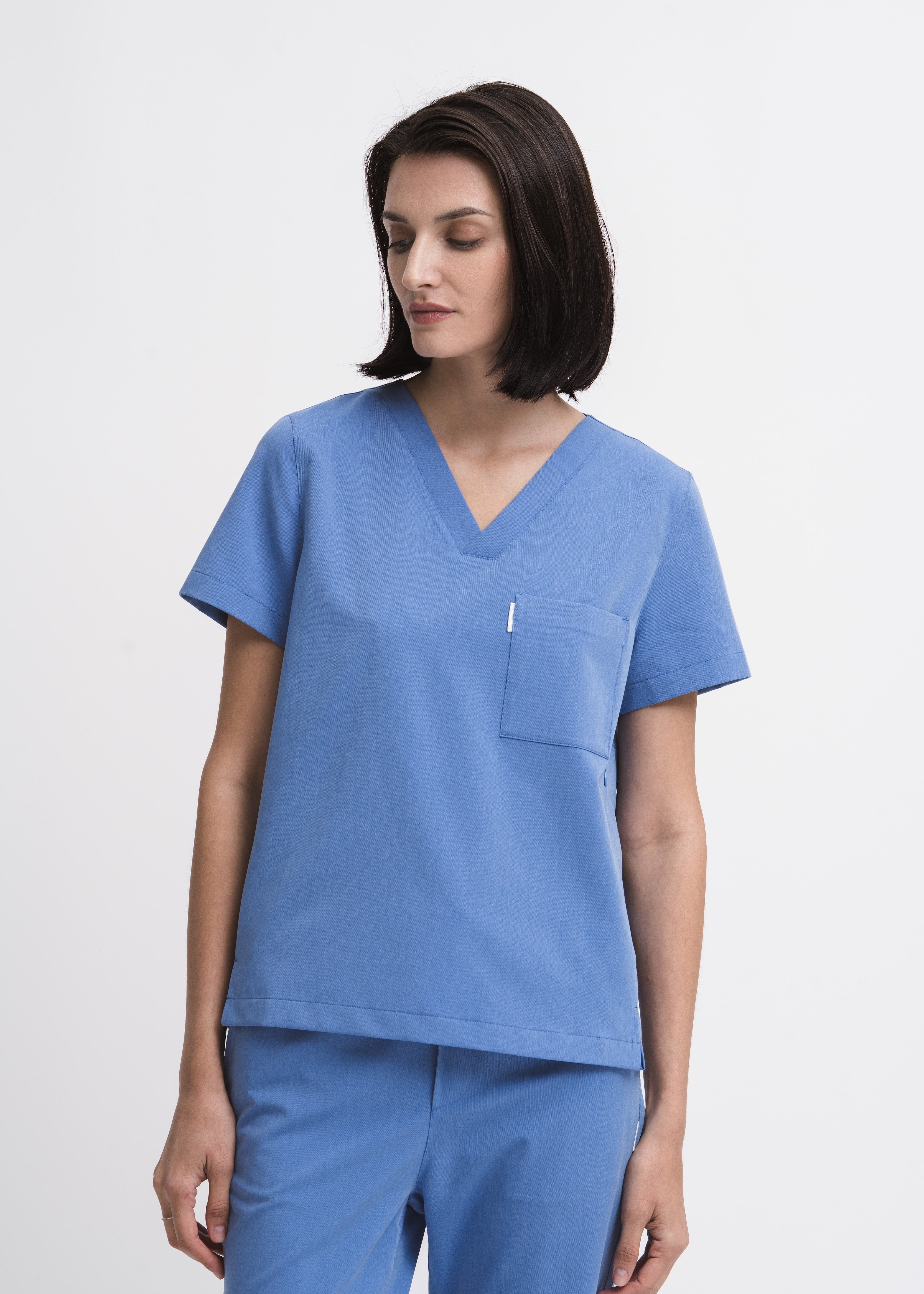 Women's V-neck scrub top in Sailor Blue, front view, full body.