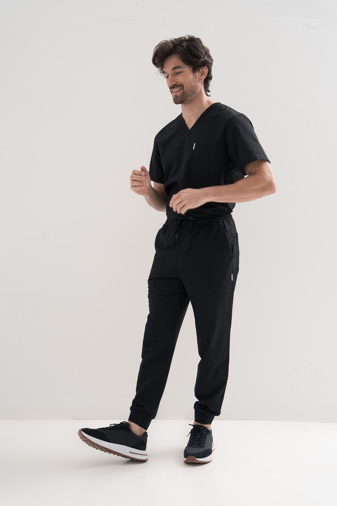 Full-body view of Men’s Core V-Neck Scrub Top in navy – modern, functional medical apparel for healthcare