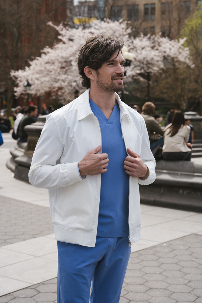 Men’s lightweight cotton doctor jacket styled in a clinical setting – modern and refined medical wear