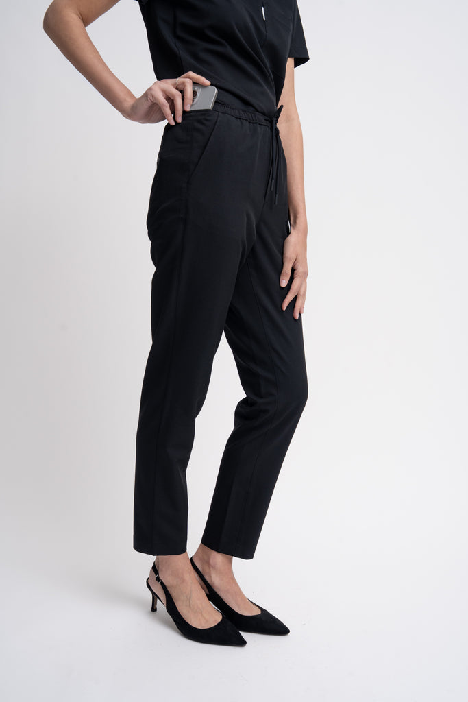 Close-up detail of the women's scrub pant in black.