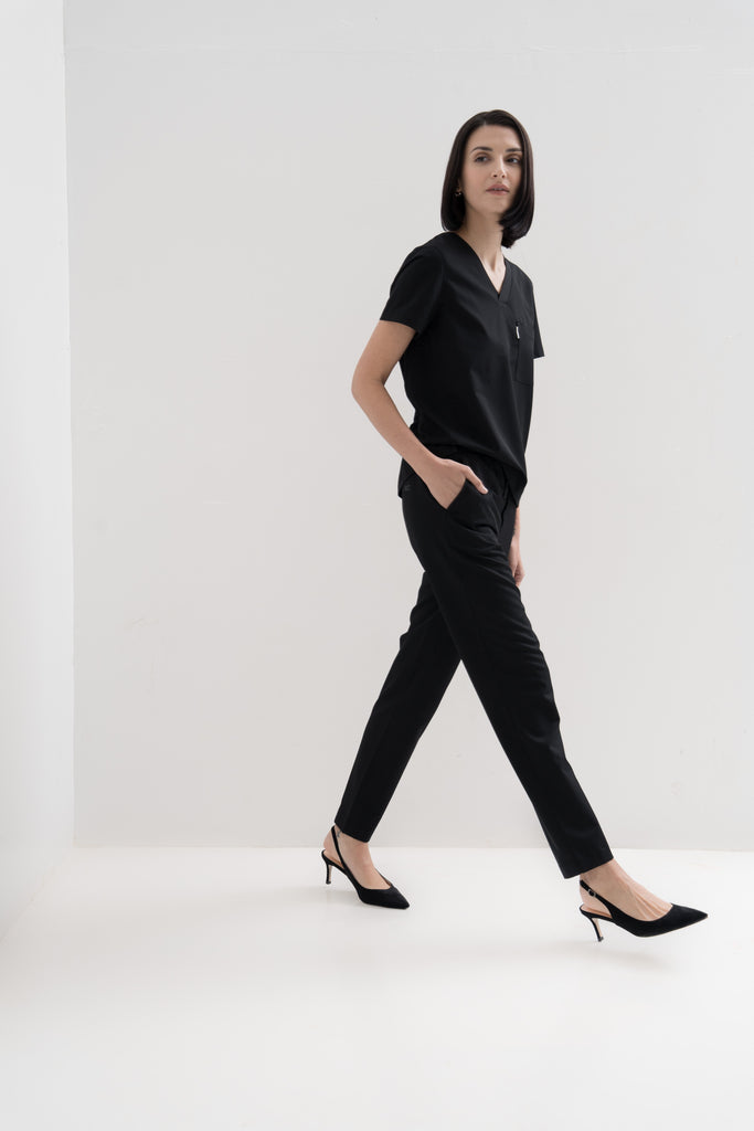 Women's scrub pant in black, full body view.