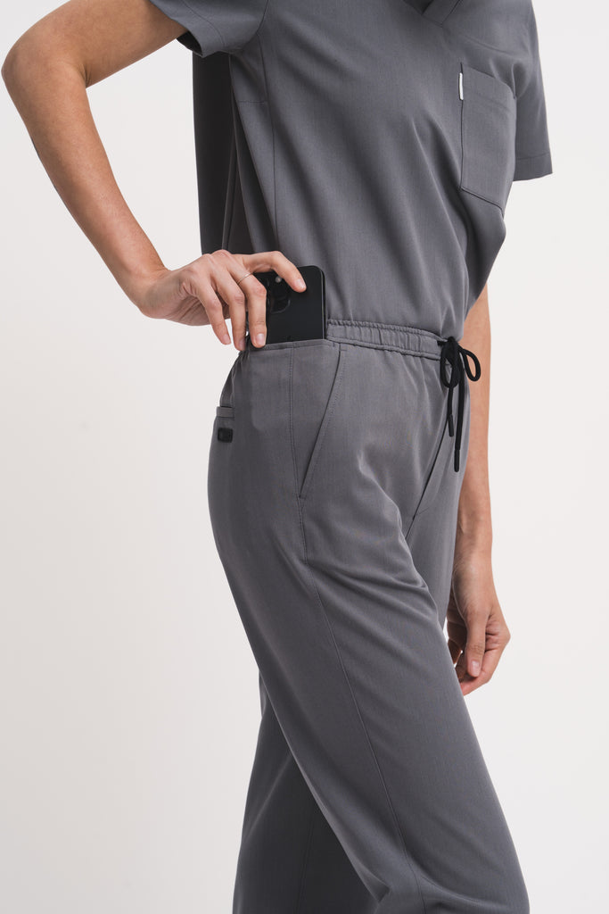 Close-up detail of the women's scrub pant in grey.