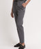 Women's scrub pant in grey, front view, half body.