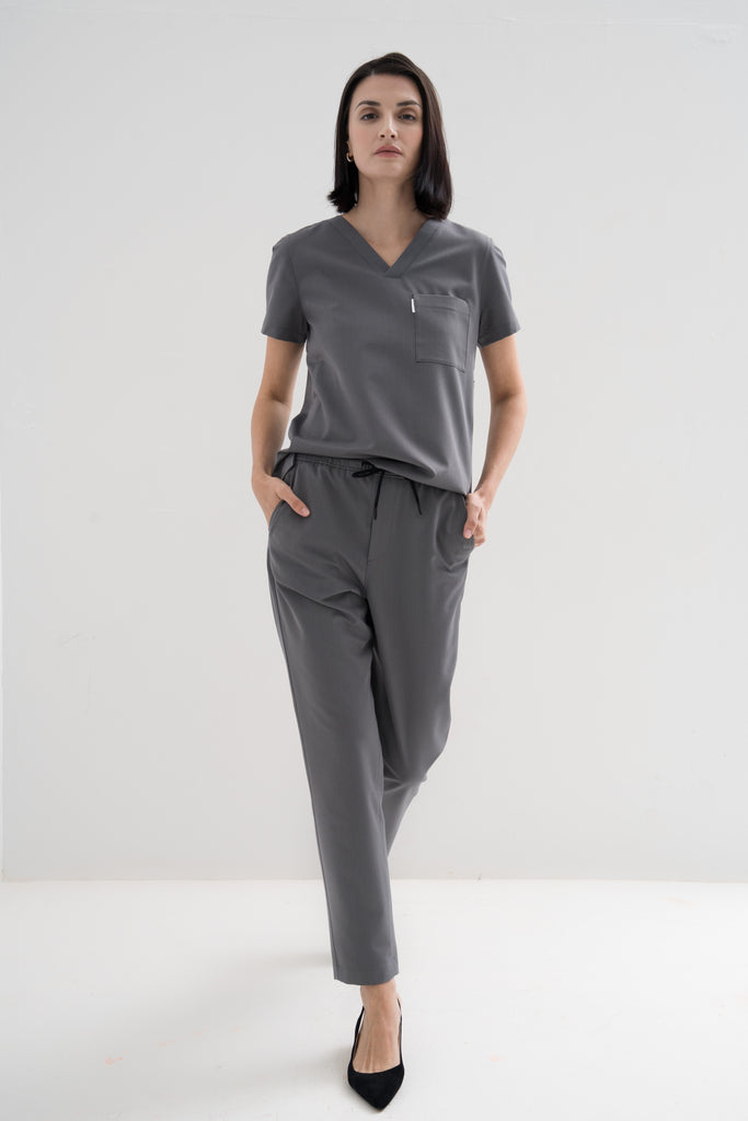 Women's scrub pant in grey, full body view.