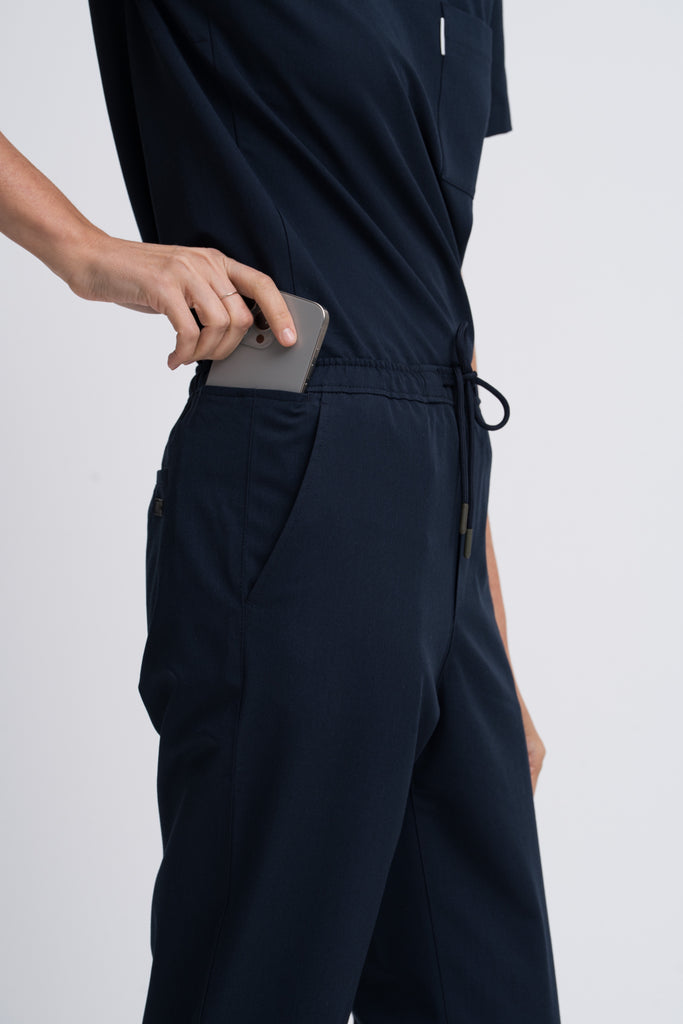 Close-up detail of the women's scrub pant in navy.