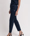 Women's scrub pant in navy, front view, half body.