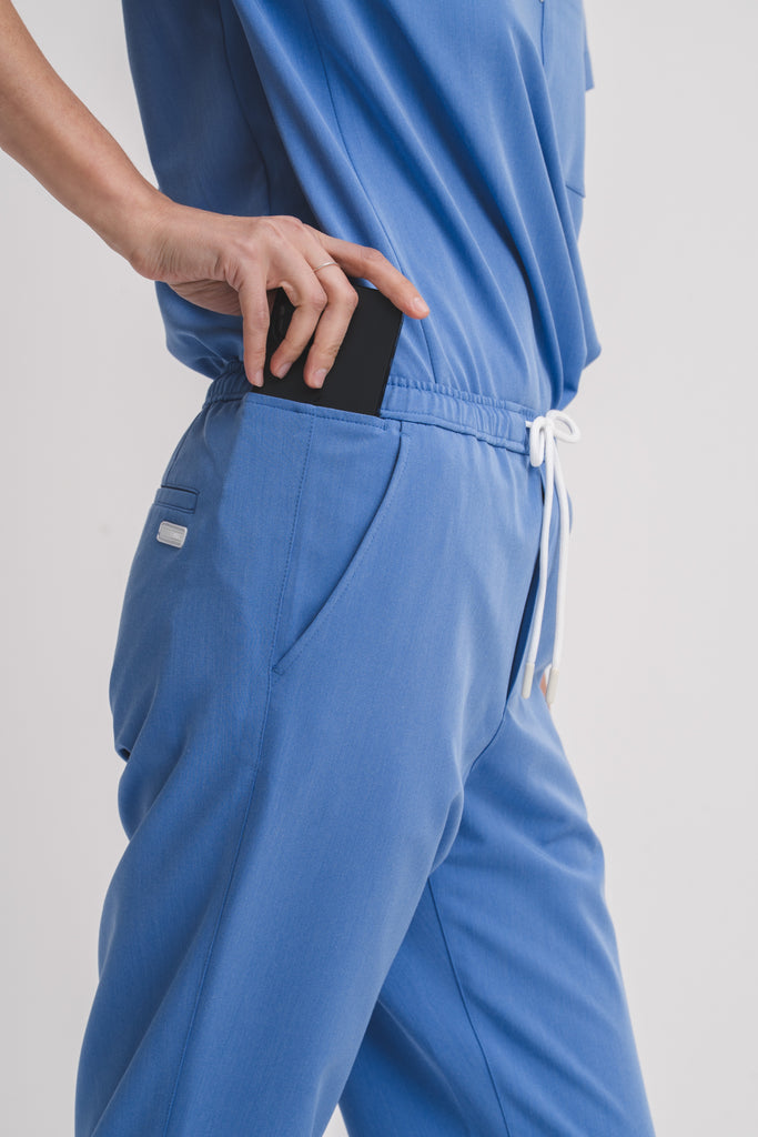 Close-up detail of the women's scrub pant in Sailor Blue.