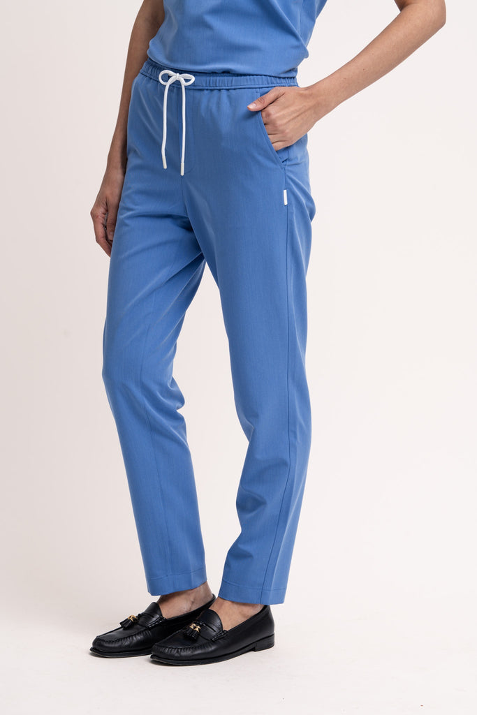 Women's scrub pant in Sailor Blue, front view, half body.