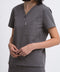 Close-up detail of the women's V-neck scrub top in grey.