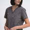 Close-up detail of the women's V-neck scrub top in grey.