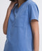 Close-up detail of the women's V-neck scrub top in Sailor Blue.