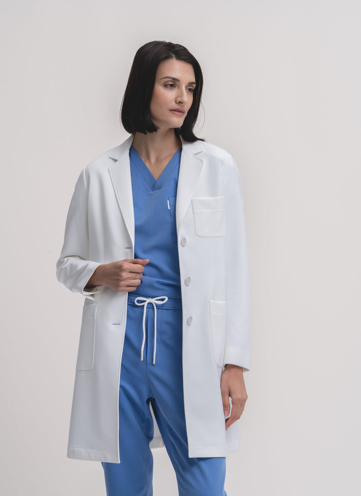 Women's V-neck scrub top in Sailor Blue, front view, full body.